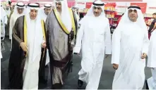  ??  ?? Informatio­n Minister Sheikh Salman Al-Humoud Al-Sabah tours the exhibition with Saudi Ambassador Abdulaziz Al-Fayez (left).