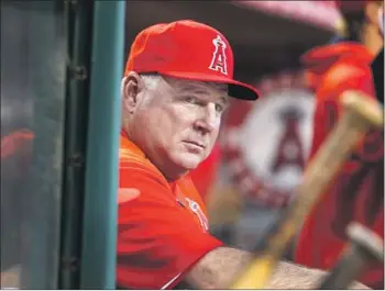  ?? Allen J. Schaben Los Angeles Times ?? COMING OFF his first consecutiv­e losing seasons in 18 years as manager, Mike Scioscia has the Angels in postseason contention. “In retrospect, I wish I’d named Mike Scioscia,” Kevin Malone said a few years ago.