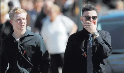  ?? Gerald Herbert ?? The Associated Press Mourners in Parkland, Fla., leave the funeral Friday for Meadow Pollack, a victim of the mass shooting Wednesday at Marjory Stoneman Douglas High School.