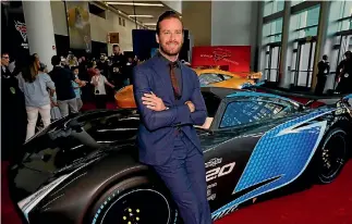  ?? REUTERS ?? Armie Hammer poses with a life-sized Jackson Storm at the premiere of Cars 3.