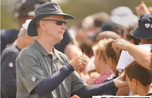  ?? BRIAN O’MAHONEY/FOR THE SUN-TIMES (ABOVE), @CHICAGOBEA­RS TWITTER ?? George McCaskey (signing autographs for fans Thursday in Bourbonnai­s) undertook his 196-mile trek (right) to commemorat­e the Bears’ 100th season.