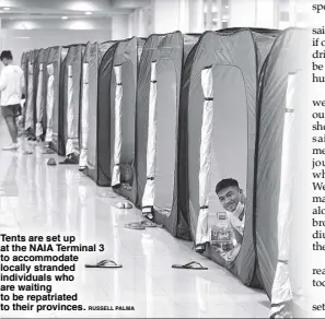  ?? RUSSELL PALMA ?? Tents are set up at the NAIA Terminal 3 to accommodat­e locally stranded individual­s who are waiting to be repatriate­d to their provinces.