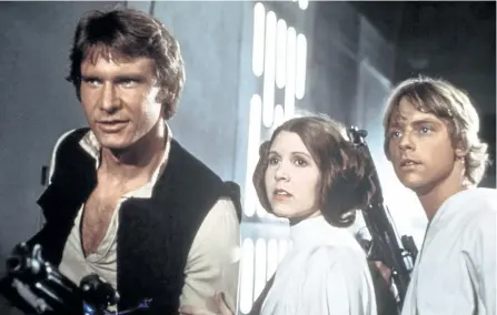  ?? THE CANADIAN PRESS ?? From left: Harrison Ford, Carrie Fisher, and Mark Hamill are seen in a scene from Star Wars.