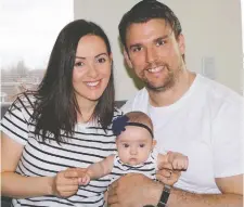  ??  ?? Nolan MacMillan and wife Elisa hold Camilla, born nine weeks premature.