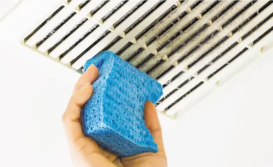  ?? Shuttersto­ck ?? Cleaning air vents and replacing your air filter are just two simple home maintenanc­e tasks you can take on this summer.