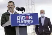  ?? ANDREW HARNIK AP ?? On Oct. 24 in Dallas, Pa., Bill Kane, a teacher at Crestwood High School, speaks at a campaign event for Joe Biden, right. Biden’s plan to give teachers a raise and eliminate the funding gap between white and non-white districts will require the cooperatio­n of Congress.