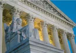  ?? PATRICK SEMANSKY/AP 2022 ?? Part of the Supreme Court Building is illuminate­d on Capitol Hill.