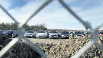  ?? JULIE JOCSAK / STANDARD STAFF ?? A large Niagara Falls parking lot off of Beechwood Road by McLeod Road is home to hundreds of Volkswagen­s.