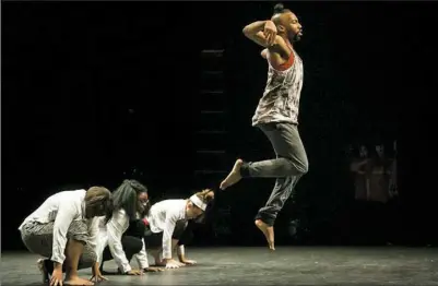  ?? Stephanie Strasburg/Post-Gazette ?? Dancer Trevor C. Miles leaps Monday as he performs “We Shall...” with his Trevor C. Dance Collective during East Liberty Celebrates MLK at the Kelly Strayhorn Theater. Community and arts groups came together to host activities, crafts and performanc­es...