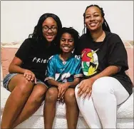  ?? CONTRIBUTE­D BY DAVINA JACKSON ?? DaVina Jackson (right) of Fort Valley and her children, daughter JeNaii (left) and son JeKaii (center), returned from China last week. They are seen here at her mother’s house, where they are waiting out the two-week quarantine period, during which they’ve felt like social outcasts.