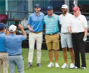  ?? SETH WENIG/AP ?? Former President Donald Trump, from right, golfer Dustin Johnson, golfer Bryson DeChambeau and Eric Trump pose for a photo Thursday as they play together during the pro-am round of the Bedminster Invitation­al LIV Golf tournament in Bedminster, New Jersey.