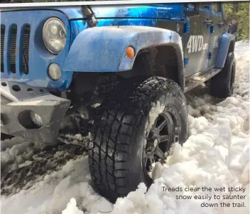  ??  ?? Treads clear the wet sticky snow easily to saunter down the trail.