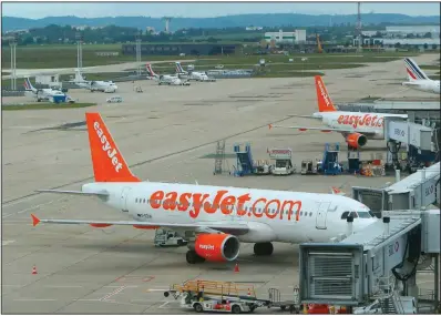  ?? (AP) ?? EasyJet passenger planes sit parked at Orly Airport west of Paris in this file photo. An advertisem­ent by the U.K.-based budget airline angered Italian officials.