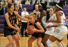  ?? BARRY TAGLIEBER — FOR MEDIANEWS GROUP ?? Pope John Paul II’s Amelia Kennedy, center, grabs the rebound Monday as Phoenixvil­le’s Nailah Green, second from right, and Angelina Williams, right, defend and Pope John Paul II’s Kayla Ciuba looks to help.