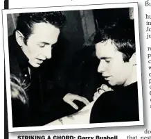  ??  ?? STRIKING A CHORD: Garry Bushell
with Joe Strummer in 1978