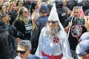  ?? Associated Press file ?? Last month, a KKK rally opposing removal of a Robert E. Lee statue in Charlottes­ville, Va., ended when police were forced to use tear gas on protesters.