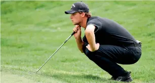  ?? AFP ?? Thomas Pieters of Belgium prepares for a birdie putt on the 18th green. —