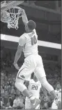  ?? NWA Democrat-Gazette/ANDY SHUPE ?? Arkansas’ Daniel Gafford dunks Feb. 10 against Vanderbilt at Walton Arena in Fayettevil­le. Gafford was named SEC Freshman of the Week for the third time Monday.