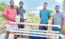  ??  ?? Ricardo Chambers (left) CEO and managing director of Chambers Hydrofarm, with his mentees and workers (from left) Jamie Salmon, Miguel Salmon and Romaine Richards.