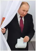  ??  ?? Victory: Mr Putin yesterday