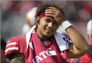  ?? TONY AVELAR — THE ASSOCIATED PRESS ?? 49ers quarterbac­k Trey Lance stands on the sideline during a preseason football game against the Las Vegas Raiders in Santa Clara on Sunday.