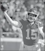 ?? The Associated Press ?? CHIEFS QB: Chiefs quarterbac­k Patrick Mahomes throws a pass Sunday during the second half of a 30-23 win over the Denver Broncos in Kansas City, Mo.