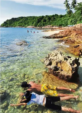  ??  ?? Perhentian, with its crystal clear waters, is a great place for snorkellin­g.