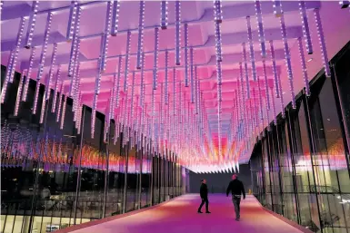  ?? Photos by Scott Strazzante / The Chronicle ?? Lighting artist Leo Villareal’s “Point Cloud” over Howard Street connects the two sides of Moscone Center.