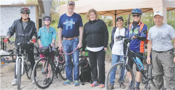  ?? [ALI WILSON / THE OBSERVER] ?? The weather was in keeping with the event’s title as hikers gathered May 13 for the annual Spring on the Trail event at the Middlebroo­k Road, West Montrose entrance of the Goderich to Guelph Rail Trail (G2G). Among those taking part were Randy Remigis,...