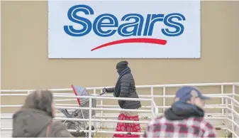  ?? SETH WENIG/AP ?? Shoppers outside a Sears store in Hackensack, New Jersey, this month. The Sears rescue plan from Chairman Eddie Lampert still needs approval from a bankruptcy judge.