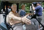  ?? AP PHOTO - PAT WELLENBACH ?? Former President Bill Clinton, left, reaches to shake a hand of a wellwisher as he and former President George H.W. Bush head off to start a round of golf at the Cape Arundel Golf Club in Kennebunkp­ort, Maine, Tuesday, June 28,