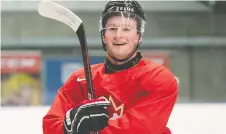  ?? RYAN REMIORZ/ THE CANADIAN PRESS FILES ?? Alexis Lafreniere was all smiles at the world juniors a year ago in the Czech Republic, but he won't be playing for Canada this time around in Edmonton and Red Deer, Alta.