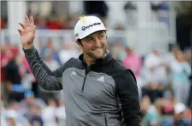  ?? GERALD HERBERT - AP ?? Jon Rahm waves to the gallery as he arrives at the 17th hole during the third round of The Players Championsh­ip golf tournament Saturday, in Ponte Vedra Beach, Fla.