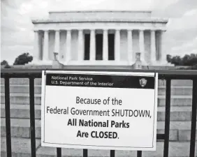  ?? CAROLYN KASTER/AP FILE ?? The Lincoln Memorial is closed on Oct. 1, 2013, during a shutdown. Many services will be disrupted if the approachin­g shutdown occurs.