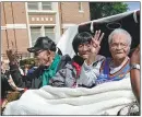  ?? SUE OGROCKI / ASSOCIATED PRESS ?? Tulsa massacre survivors, from left, Hughes Van Ellis, Lessie Benningfie­ld Randle, and Viola Fletcher, in a horsedrawn carriage before a march in the city.