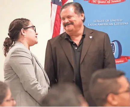  ?? MIKE DE SISTI / MILWAUKEE JOURNAL SENTINEL ?? League of United Latin American Citizens President Domingo Garcia, right, talks Wednesday with LULAC Chief Executive Officer Sindy Benavides between speakers during a news conference at UMOS Corporate Headquarte­rs at 2701 S. Chase Ave. to open the LULAC national convention. The gathering is being held this week at the Milwaukee Convention Center.