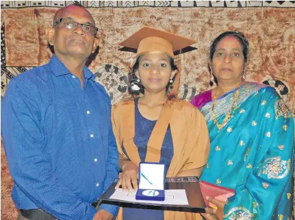  ??  ?? Shayal Shivani, with her parents Mukesh Chand and Sunil Lata, showing her award.