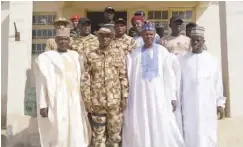  ??  ?? Commanding Officer (CO), 5 Brigade Nigerian Army, Damasak (middle) flanked with the Borno State Commission­er for Local Government­s and Emirate Affairs, Sugun Mai Mele and the State House of Assembly Member, representi­ng Mobbar LGA, Usman Lawan Moruma