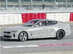  ?? KIA ?? Graeme Fletcher behind the wheel of the 2018 Kia Stinger prototype.