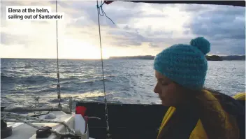  ??  ?? Elena at the helm, sailing out of Santander