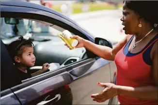  ?? David J. Phillip / Associated Press ?? Katherine Gibson-Haynes, right, helps distribute infant formula during a baby formula drive on Saturday in Houston.