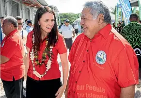  ?? JASON OXENHAM ?? Samoan Prime Minister Tuilaepa Malielegao­i and Jacinda Ardern chat before the Pacific leaders gather for a formal photo opportunit­y.