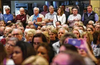  ?? CURTIS COMPTON/AJC 2019 ?? The debate on whether to form the city of East Cobb has percolated for a while. In March 2019, supporters and opponents pack a town hall on the issue at the Catholic Church of St. Ann in Marietta.