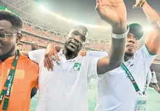  ?? — AFP photo ?? Ivory Coast’s coach Fae (centre) celebrates after his team won the Africa Cup of Nations (CAN) final match between Ivory Coast and Nigeria at Alassane Ouattara Olympic Stadium in Ebimpe, Abidjan.