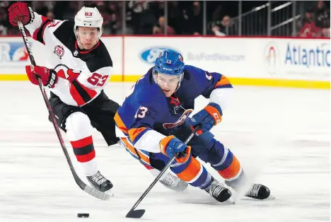  ?? ADAM HUNGER/GETTY IMAGES FILES ?? Vancouver Canucks rookie Brock Boeser is leading all NHL rookies in goals, but Coquitlam native Mathew Barzal, right, might have a lock on scoring among first-year players, having put up 67 points so far for the New York Islanders.