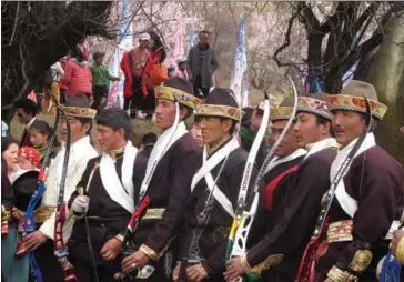  ??  ?? Tibetan residents at the Kala village in Nyingchi have an archery contest in March.