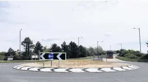  ??  ?? Llanelli’s iconic roundabout swirl cone sculpture near Bynea on A484 has been deemed unsafe and removed following a collision.