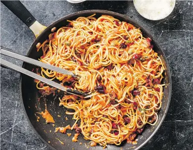  ?? — THE ASSOCIATED PRESS ?? Anchovies, garlic and red pepper flakes provide a rich, savory foundation of flavour for Skillet Pasta Puttanesca.