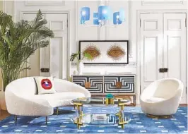  ?? JONATHAN ADLER ?? Jonathan Adler’s Wondrium decorating series emphasizes expressing your own personalit­y in your home. His Ether curved sofa makes a visual statement in this room and his “Eyes” wall art adds a cheekiness factor.