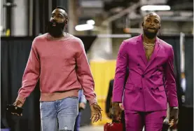  ?? Ezra Shaw / Getty Images ?? Rockets James Harden, left, and P.J. Tucker don’t shy away from bold fashion statements. Tucker recently bought a beaded jacket for $25,000 in Paris.